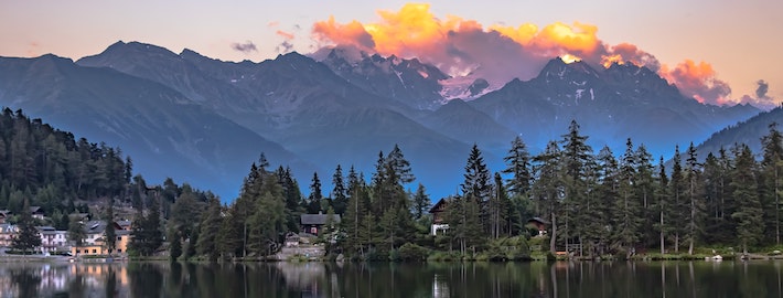 photograph of a beautiful sunset over the Swiss alps in the summer time